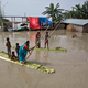 Villagers affected by the flooding near the Brahmaputra River in Assam, India. Photo: AP